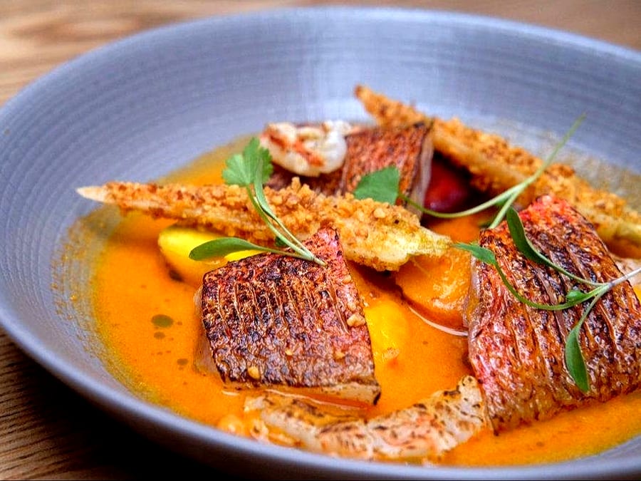 Grilled oysters from Tavira prepared by chef Frederic Duval